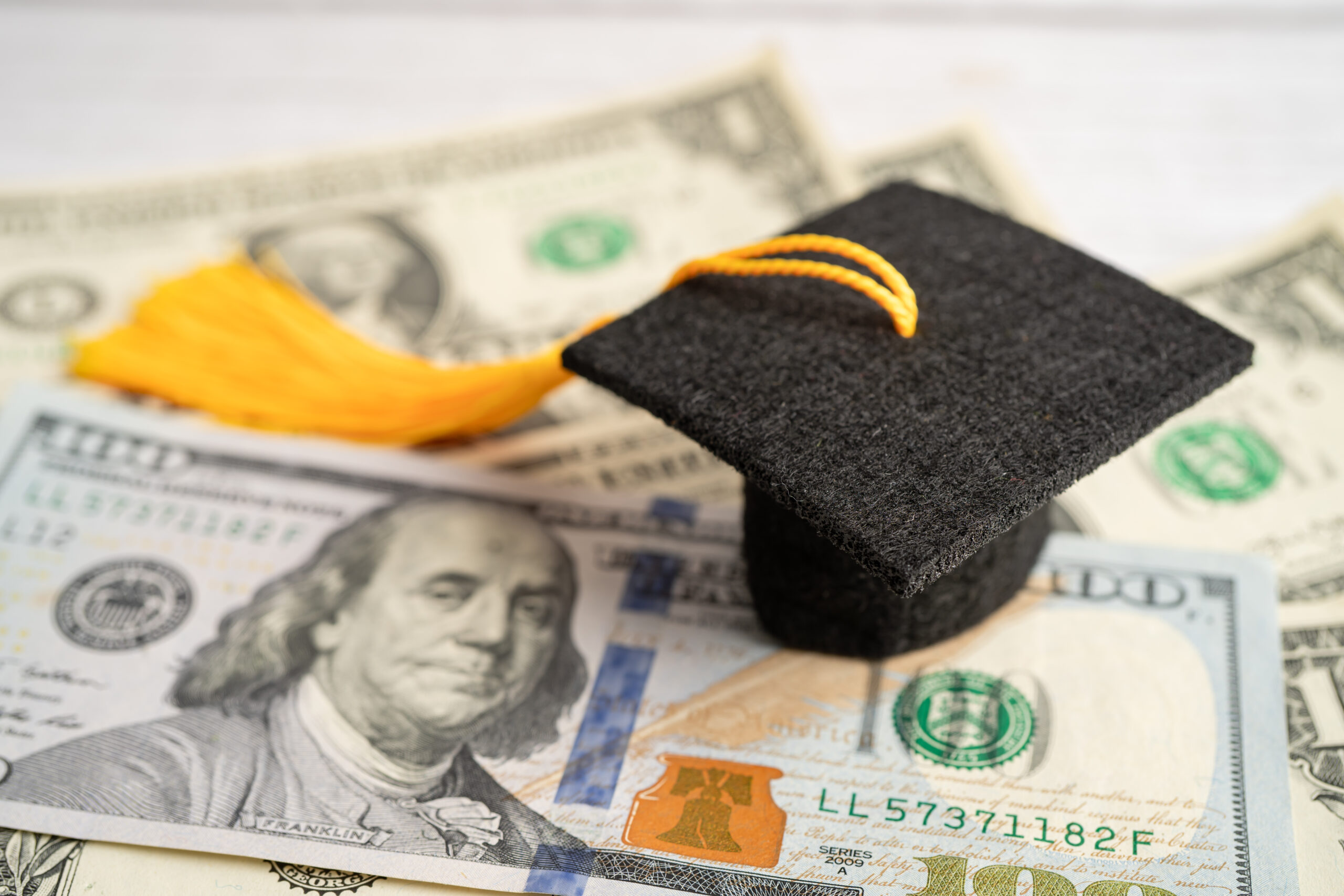 graduation gap hat on us dollar banknotes money e 2023 11 27 05 09 08 utc