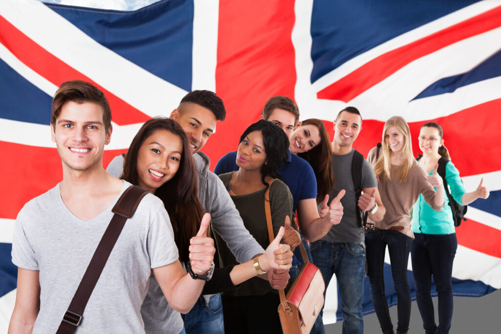 Group,Of,Happy,Multi,Ethnic,Students,Standing,In,Front,Of